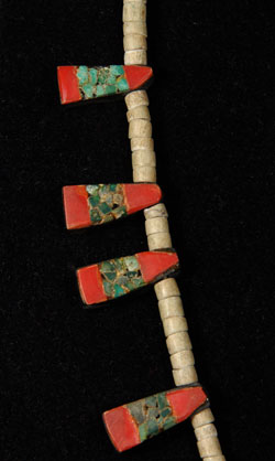 During the 1930s when the Depression-era was in full swing, New Mexico Pueblo Indians were severely affected. At Santo Domingo Pueblo (now Kewa Pueblo), the Indians became very resourceful and began producing jewelry from whatever material they could find. One particular folk art creation they produced has become a very collectible item: the Depression-era necklace.  Production continued at a lesser rate into the mid-20th century.  This necklace was made from several “found materials.” The beads were made from bone, the black backing probably from automotive battery boxes, the red from toothbrush handles or something similar, and the turquoise is genuine. These necklaces were usually in the squash blossom style, with pendants protruding from the sides and a bird pendant at the bottom, as is this one.  When we acquired this one, it came with two triangular shaped pendants that could easily be converted to earrings.  They are included with the purchase of the necklace.  Condition:  It is in very good condition. Provenance: from a Santa Fe resident Recommended Exhibit:  A current exhibit of an extremely large quantity of these necklaces is at the Wheelwright Museum in Santa Fe.  It is highly recommended as a source to learn more about this wonderful period of pueblo ingenuity. Recommended Reading: Santo Domingo Pueblo Jewelry by Sally and J. Roderick Moore in The Magazine Antiques, Brant Publications, Inc. July 2009, vol. CLXXVI, no. 1. pp. 56-61. 