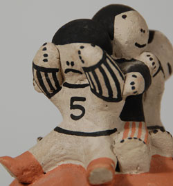 This charming turtle figurine was created by Cochiti potter Buffy Cordero, granddaughter of the famed Helen Cordero.  Helen Cordero was the creator of the "mother turtle" figurine which this represents.  She said that there was a legend at Cochiti that refers to a turtle rescuing the children in time of peril and taking them to safety.  This turtle figurine with five children astride its back is an engaging figure that brings a smile to one’s face.  It is signed Buffy Cordero Suina. To the best of my knowledge, Buffy is no longer actively making pottery.  I believe she stopped potting before Helen passed away in 1994.    Condition: very good condition after a small repair to the turtle’s tail  Provenance: from a gentleman in Missouri  Recommended Reading: The Pueblo Storyteller: Development of a Figurative Ceramic Tradition by Barbara Babcock, et al. 