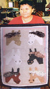 Fannie Pete holding this rug