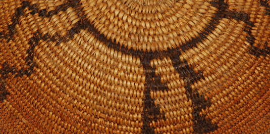 Small baskets such as this one were made for home use as well as for sale but it remains true to Apache basketry form.  The zigzag lines represent rattlesnakes.  The basket was very tightly woven and has taken on a golden patina from age, estimated to be about 100 years.