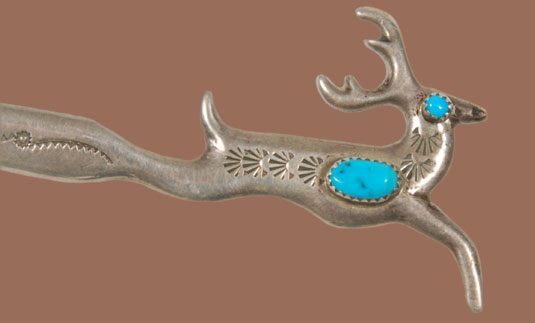Close up view of the leaping deer letter opener.