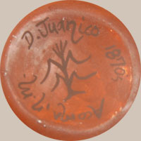 Delores creates miniature pottery and applies designs from published historic pottery.  This jar has a design she chose from a published Acoma jar from circa 1970s.  She acknowledges this by putting the date of the original jar on the bottom of her jar.  The design on this jar is from the book The Pottery of Acoma Pueblo by Harlow and Lanmon.