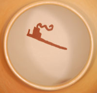 Artist Mark Tahbo (1958- ) Hopi &ndash; Tewa - signed the jar with his hallmark tobacco pipe placed on the inside of the jar.