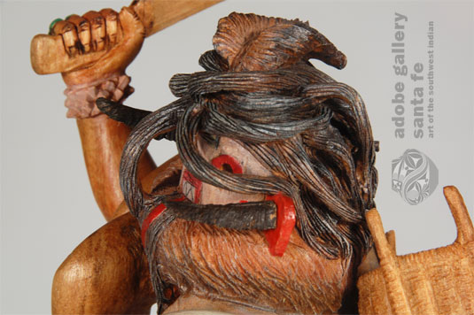 Close up view: One is immediately drawn to the hair of the doll which drapes over her face and is a maze of complicated swirls behind her head.  Pochoema said each grouping of hair is from the original wood, none being added or glued in place.  It appears nearly impossible to carve such a maze of tangles, but he did it.