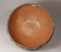 It is always fascinating to acquire an object that has a continuous stream of provenance from its earliest days.  That is the case with this wonderful Zia Pueblo bowl.  Not only is the bowl an exquisite one, it has great provenance.  The bowl was among a large collection of Native American art objects presented to the Cleveland Museum of Art in 1937 as a gift from Miss Amelia E. White of Santa Fe.  According to an announcement by the Museum “The gift comes from Miss Amelia Elizabeth White, who has long been interested in the welfare of the American Indian.  Miss White was a moving spirit in the organization of The Exposition of Indian Tribal Arts in 1930, and was Chairman of its Executive Committee.  By acquiring fine examples of Indian art and by maintaining a gallery for their exhibition and sale in New York, Miss White continued the purpose of this exposition, namely, ‘ . . . of stimulating and supporting Indian artists by creating a wider interest and more intelligent appreciation of their work . . . and to demonstrate what important contribution to our culture the Indian is making.’  She furthered this purpose still more by dispersing her large collection among museums in order that a larger number of people might become acquainted with Indian products.”  The Amelia White home and extensive property in Santa Fe became the grounds and buildings of the School for Advanced Research.  When this bowl was put up for sale at Sotheby’s in New York in its May 18, 2007 auction, a member of the Board of Directors of the School for Advanced Research purchased it for her own collection because she was drawn to the Amelia White provenance.  This person eventually consigned the bowl to a Santa Fe Gallery to be sold. A client of ours purchased it at that time and now we have acquired it from this client.   It appears that at some unknown date, the Cleveland Museum de-accessioned the bowl and Albright-Knox Art Gallery, Buffalo, New York, added it to its collection.  The Albright-Knox Gallery submitted it to Sotheby’s for sale, thus eventually bringing the bowl back to Santa Fe.  There are old stickers on the bowl that state “Zia Pueblo Zuni” and “Zia 19 Cent. Albright Art Gallery, Buffalo, N.Y.”  The Albright-Knox Art Gallery number is 37:12:19, gift of Miss Amelia E. White, 1937. Condition:  The bowl is in excellent condition.  There is on very minor interior-rim chip of no great significance.  Provenance:      Miss Amelia Elizabeth White, Santa Fe, NM 		Cleveland Museum of Art 		Albright-Knox Art Gallery, Buffalo, NY 		Sotheby’s May 18, 2007 Auction 		ex.coll. Dallas and Santa Fe resident 		ex.coll. Washington, DC collectors  Recommended Reading: The Pottery of Zia Pueblo by Harlow and Lanman 