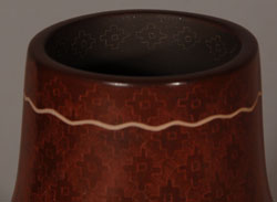 Jody Naranjo is a prize-winning potter from Santa Clara Pueblo who has taken the art form of Pueblo pottery to a brand new level. She has been awarded prizes since she was a teen.  She comes from a family of prize-winning potters and artists.   While continuing the tradition of hand coiling and hand polishing pottery as done by her ancestors she brings a totally contemporary vibrancy to her work.    In this jar a series of spirited riders runs across the shoulder of the vase.  The horses and riders are slipped with micaceous brown clay that rests on an intricate sgraffito background. It is an absolutely wonderful piece that has a sense of freedom and joy about it. The craftsmanship is flawless. The jar is signed and dated 2011.   Condition: This jar is new and in original excellent condition  Recommended Reading:  Pueblo Indian Pottery 750 Artist Biographies by Gregory Schaaf  Provenance: from the artist 