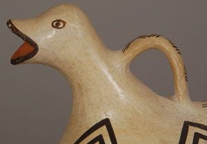 Lucy Lewis was one of the most widely respected potters of the 20th century from her pueblo. This wonderful duck effigy pitcher is testimony to her talents.  The vessel was formed expertly and the painted design was applied to perfection.  The lines of the painted design are strong, straight, and perfectly balanced.  It is not an easy task to paint a design on a round surface using yucca-leaf for a paint brush.   As is traditional, it was constructed of native Acoma clay and hand coiled, then sun-dried and sanded to a smooth surface, after which a white slip was applied to the entire vessel and polished to a high sheen. The design was painted over the slip, and the vessel was then fired.  There is no spalling of the clay so the pitcher was probably made before the 1960s when the Acoma clay was still abundant and without impurities. Condition: The pitcher is in remarkable condition. Recommended Reading: 14 Families in Pueblo Pottery by Rick Dillingham  Provenance: from the collection of Kathryn H. Rust 