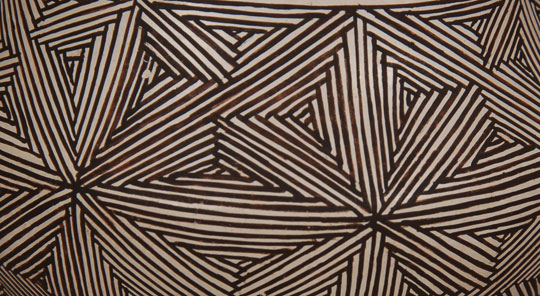 Lucy Lewis is a potter that most collectors recognize because she was at the forefront of potters following World War II when pueblo pottery began to be collected in earnest.  One of her best-known designs was this complicated fine line style where the lines crossed in every direction.  One must remember that these were painted using a brush fashioned from the leaf of a yucca plant.  That certainly must have added to the complexity.  Condition:  This jar is in very good condition.  There is only one very small spall mark and one has to search for it to find it.  Provenance: from an Albuquerque gentleman Recommended Reading:  14 Families in Pueblo Pottery by Rick Dillingham 