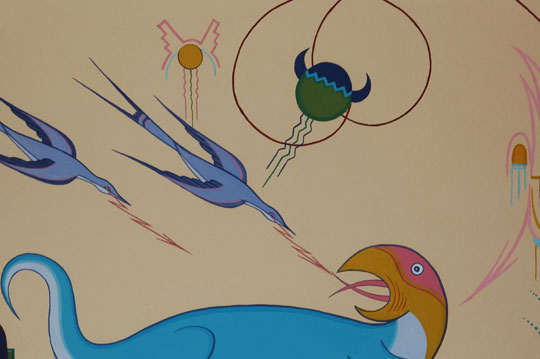 A typed note on the original brown paper on verso of these painting states:   “In the origin stories of the Indians they mention the pre-historic animals, each of giant proportions.  The water turkey was adored by the Indians and to this day, feathers are still used in their sacred ceremonies.  “This painting is a perfection of the elements.  The swirling lines are the movements of the wind.  The piled up clouds releasing rain on symbols of the high mountains—the growing grass and the sun that caused its growth, and the female moon at the top center—the symbol of fertility.” 