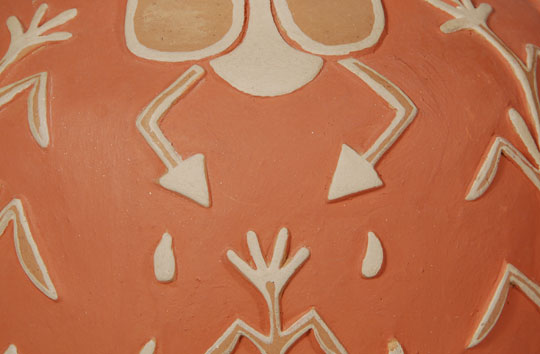 Martina Aquino (c.1920-1982) was the mother of Diego Aquino and they worked together starting in the 1970s for 10 years or less.  Martina is listed as having received a First Prize at Santa Fe Indian Market in 1974 and several other awards through 1981.  Diego received awards at Santa Fe Indian Market from 1976 to 1981 as well.  Both artists were included in the Albuquerque Museum “One Space/Three Visions” exhibit in 1979.  This jar features corn plants in bas relief encircling the jar and rain clouds pendant from the neck of the jar with rain drops falling around a corn plant.  The red rim and red underbody are stone polished and the designed area is matte finish.  Condition:  original condition  Provenance: from the collection of Katherine H. Rust  Recommended Reading:  Pueblo Indian Pottery 750 Artist Biographies by Gregory Schaaf 