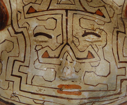 Shipibo pottery is fashioned by the natives of Northern Peru, South America.  The pots are hand coiled and built up similar to pueblo pottery.  No potter’s wheel is used. They are fired in an outdoor firing.  Although there are no written records defining the designs, it has been speculated that the designs are derived from body tattoos adopted by the natives.  It has also been speculated that the designs feature intricate geometrics inspired by the visions seen while ingesting a brew used by the natives as a ceremonial sacrament.  Regardless of the origin or meaning of the designs, the pottery is phenomenally beautiful and intriguing.  Condition:  some rubbing of nose area but overall the jar is in excellent condition Provenance: from the collection of Katherine H. Rust 