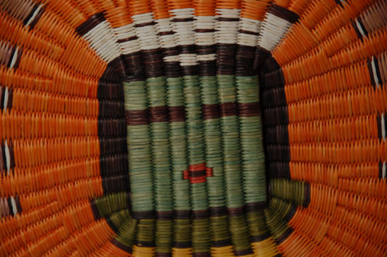 Hopi Third Mesa Wicker Kahaila Katsina Image Plaque Southwest Indian Baskets Plaques Hopi Pueblo Hazel Koyiyumptewa “This kachina is presumed to be from the Rio Grande as his name is Keresan (language of Kewa, Cochiti, San Felipe, and others). Fewkes shows a good drawing of this kachina in Pl. XLVII of his publication Hopi Kachinas but calls the personation ‘Kwacus Alek Taka.’ This name simply means ‘eagle feathers erect man,’ a descriptive term for Kahaila. The kachina appears in a regular dance with Alo Mana and is often called the Hunter Kachina.” Wright 1973 Plaques are an important part of Hopi culture. They are used in everyday activities, women carry them in plaza dances, they are gifts to friends and families for favors rendered, and they are used as payback to relatives and friends for gifts received. They are also an important item for the women to sell to tourists and collectors. Probably half of them are made for Hopi use and the other half end up on the market. Condition: original condition Provenance: from the collection of an Arizona resident Recommended Reading; Hopi Basket Weaving: Artistry in Natural Fibers by Helga Teiwes