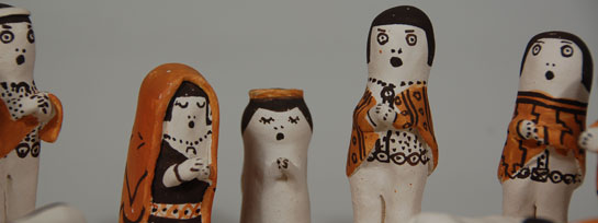 Juana Leno became active in making pottery in 1937 and quickly became known for her use of Anasazi Revival and Tularosa designs.  When she began making nacimientos, the figures were simple and bell shaped.  She always used natural pigments and her designs were very precise.  This nacimiento consists of a standing Mary, Joseph, three wise men, an angel, two shepherds and four barn animals.  The Christ Child is on a decorated clay manger.  All of the pieces are hand formed and painted with great detail.  The nacimiento is signed Leno Acoma, N Mex under the manger.  Condition:  very good condition Provenance:  from a Santa Fe collector Recommended Reading:  Nacimientos by Guy and Doris Monthan 