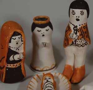 Juana Leno became active in making pottery in 1937 and quickly became known for her use of Anasazi Revival and Tularosa designs.  When she began making nacimientos, the figures were simple and bell shaped.  She always used natural pigments and her designs were very precise.  This nacimiento consists of a standing Mary, Joseph, three wise men, an angel, two shepherds and four barn animals.  The Christ Child is on a decorated clay manger.  All of the pieces are hand formed and painted with great detail.  The nacimiento is signed Leno Acoma, N Mex under the manger.  Condition:  very good condition Provenance:  from a Santa Fe collector Recommended Reading:  Nacimientos by Guy and Doris Monthan 