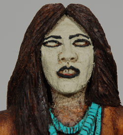 This sculpture is of a Female Skinwalker, which, in Navajo legend, would be much rarer than male Skinwalkers. There are several varieties of Navajo witches, one of which is using his (rarely her) powers to travel in animal form. In some versions, men or women who have attained the highest level of priesthood are called "pure evil."    They are human beings who have gained supernatural power by breaking a cultural taboo. Specifically, a person is said to gain the power to become one upon initiation into the Witchery Way. Both men and women can become skinwalkers, but men are far more numerous. It is generally thought that only childless women can become witches.  Larry Jacquez (pronounced Hackus) is a Navajo folk art carver who specializes in the unusual.  He is known to have carved and painted extraordinary objects accurately depicting the Yeis, Navajo mythology, and the dances and escapades of skinwalkers.  The Rosenaks stated that they were surprised by the appearance of skinwalkers in his work, and doubtful of their very existence, but Jacquez told them that “evil witches do exist.”  Some Navajo also believe that skinwalkers have the ability to steal the "skin" or body of a person. The Navajo believe that if you lock eyes with a skinwalker, they can absorb themselves into your body. It is also said that skinwalkers avoid the light and that their eyes glow like an animal's when in human form, and when in animal form their eyes do not glow as an animal's would. Some Navajos believe that if you make eye contact with a skinwalker, your body will freeze up due to the fear of them and they then use that fear as energy against the person. A skinwalker is usually described as naked, except for an animal skin. Some Navajos describe them as a mutated version of the animal in question. The skin may just be a mask, like those which are the only garment worn in the witches' song.   This carving of a female skinwalker is basically naked as skinwalkers are thought to be.  She does wear a concha belt from which is draped a loin cloth on front and back.  She is elaborately decorated with turquoise jewelry and her right hand covers her exposed right breast but the left one is visible.  In her left hand, she carries the skin of a fox.  This carving is not signed by the artist but is authenticated by the Rosenaks as having been made by him.  When the features are compared with signed pieces by this artist, there is no doubt he made this one.  Condition: original condition Provenance: from the collection of Jan and Chuck Rosenak Recommended Reading: Navajo Folk Art by Chuck and Jan Rosenak Referenced Material:  the information on female skinwalkers was excerpted from Wikipedia. 