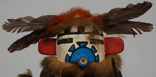 This is a rarely carved Katsina doll. He is considered to be a 20th-century import from the Rio Grande Pueblos and this is evident in his dress. He appears in the Hopi Plaza Dances and has the function of aiding in the growth of corn. He is seen annually in the dances, but rarely in the form of a carved doll.   The carving is very well accomplished for a carving from the early 1960s as carvings of that era were not always of the finest quality as haste in completing them was deemed acceptable for a sale to tourists.    Condition: very good condition with some dust evident in the feathers Provenance:   Originally purchased in June 1961, directly on the Hopi Reservation, by Alexander E. Anthony, Jr.  Sold to an Adobe Gallery client in 2002 from whose estate it is has been returned to Adobe Gallery Recommended Reading: Kachinas: a Hopi Artist’s Documentary by Barton Wright 
