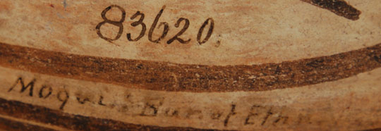 Polacca pottery style began around 1740. It did not fully become the predominant type at Hopi until about 1800, and it continued until about 1890. Polacca wares were the predominant utilitarian wares of this time period. This bowl is typical of Polacca Polychrome, Style C, which existed in the late-1800s.   Victor Mindeleff at Hopi (Moqui) collected this bowl in 1883 for the Smithsonian. On the interior of the bowl, below the rim, is inscribed, in India ink, 83620 Moqui Bureau of Ethnology.   What we generally consider to be Zuni Pueblo designs were quite prevalent on Polacca vessels. The designs on this bowl are a good example of this. Two major volute design elements fill the interior of the bowl, and a proliferation of feather elements cover the exterior. A red underbody and a black rim complete the decoration.   Condition:  The bowl was broken cleanly in half and reassembled without any attempt to conceal the break.  A chip to the rim was professionally restored.  Breakage on pottery of the significance of this one is not considered to be detrimental.  The collection history overshadows the previous breakage which could have happened at the time of collection in 1882.   Provenance:  "In 1882, Victor and Cosmos Mindeleff led an expedition to Zuni and Hopi villages to survey archaeological ruins and historic villages.....In November and December 1882 and January 1883, while Victor Mindeleff helped the Stevensons to survey Canyon de Chelly, Cosmos Mindeleff and Cushing traveled to the Hopi reservation and tried to collect on Third Mesa. Experiencing great opposition, they moved to Mishongnovi on Second Mesa and collected over 5000 pots, baskets, household objects, and agricultural tools, 4166 of which were accessioned."   Using the Smithsonian accession number painted on the interior of the bowl, the Smithsonian staff verified for us the bowl to be one of the pieces collected by Cosmos Mindeleff in 1882.  The Smithsonian de-accessioned the bowl but their records do not indicate when or to whom.  The Smithsonian at that time was overwhelmed with the sheer amount of items being collected in New Mexico and Arizona pueblos that it gave many items to other museums.  Over the years, these museums have de-accessioned some of those items which accounts for their being on the market for sale.   Quotation from "The Formation of Ethnographic Collections: The Smithsonian Institution in the American Southwest," by Nancy J. Parezo, in Advances in Archaeological Method and Theory, 10, Michael B. Schiffer, editor (1987): 1-47.   Recommended Reading: Canvas of Clay by Edwin Wade and Allan Cooke
