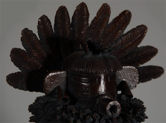 This bronze of a Talavai (Morning) Katsina is entitled “For a Better Brighter Tomorrow” and is the representation of a Hopi Katsina.  In the early morning, as the sun bursts from behind the hills in Hopi lands, morning songs spread their sound: calling birds, barking dogs, and the raised, bell-like voices of early risers greet the new day.  The spruce, the first tree touched by the sun’s rays, turns from dark shadow into green life with the illumination.  The symbols of the Morning Katsina—his bell that serves to rouse its hearers to a new day, the young spruce tree representing a new beginning, and the headdress feathered out like rays reaching in all directions—all recall the dawning of hope and excitement for a better, brighter tomorrow.  This limited edition bronze by Hopi artist Lowell Talashoma, Sr. is a manifestation of an artistic eye and vision that spans two cultures, for Talashoma is unusual in having spent many of his childhood years in the care of foster parents who raised him in a mainstream American home.  Becoming Hopi meant for him accepting a new reality and set of beliefs as well as coming to understand the traditions, ceremonies, languages and social custom implicit in his choice.  Giving form to this historically-rich culture is a task he set for himself with pleasure and excitement: what is ancient and inherently true to the Hopi people is newly rediscovered and revered through Talashoma’s dawning awareness of what it is to be Hopi.  Lowell Talashoma became a very famous carver of one-piece cottonwood katsina dolls and was selected by American Indian Life and Legends, Ltd as one of two Hopi artists to convert cottonwood katsina dolls into everlasting bronze sculptures.  Each of these bronzes was inspired by Hopi beliefs and is “liberated” from cottonwood root—the Hopi traditional carving material—through the vision of the artist of what lies within.  Although he could work faster in preparation for bronzing by using wax or clay, Talashoma preferred to interact with the wood, a material he respected for its life and character.  The castings made from his carvings via the lost wax method retain that spirit.  Even the grain of the original wood can be discerned in the finished bronze.  This bronze of the Morning Katsina was cast in an edition of 35 of which this is number 1.  It was completed in 1980.  The pedestal on which the bronze stands is on a turntable system to allow for the bronze to be viewed in various positions.  Condition: original condition Provenance: from the estate of a California family Recommended Reading: Kachinas: a Hopi Artist’s Documentary by Barton Wright 