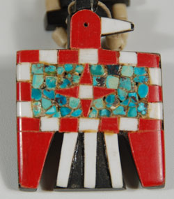 During the 1930s when the Depression-era was in full swing, New Mexico Pueblo Indians were severely affected. At Santo Domingo Pueblo (now Kewa Pueblo), the Indians became very resourceful and began producing jewelry from whatever materials they could find. One particular folk art creation they produced has become a very collectible item: the Depression-era necklace.  Production continued at a lesser rate into the mid-20th century.   This necklace was made from several "found materials." The beads were made from bone, the black backing probably from automotive battery casing, the red from toothbrush handles or something similar, and the turquoise is genuine. These necklaces were usually in the squash blossom style, with pendants protruding from the sides and a bird pendant at the bottom, as is this one.  The dark green turquoise superimposed over the black casing material displays a rich and wonderful patina against the opaque bone beads that also have assumed a warm and old patina.  The Thunderbird pendant is resplendent in all its red and white, particularly the star on the bird’s body.  This is a very good example of this style necklace.     Condition:  very good condition. Provenance: from a resident of Colorado Recommended Reading: “Santo Domingo Pueblo Jewelry” by Sally and J. Roderick Moore in The Magazine Antiques, Brant Publications, Inc. July 2009, vol. CLXXVI, no. 1. pp. 56-61. 