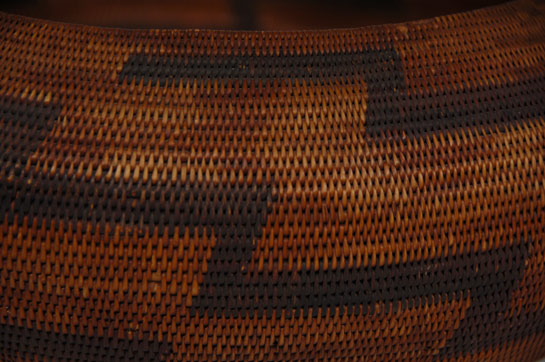 Storage baskets of this style were the largest baskets made by the Pomo Indians.  The Pomo women made these large, globular baskets to hold any variety of objects in the home—acorns, treasures, clothing and anything else they wished to store and protect.  Interestingly, larger baskets of this nature were given to the new groom by his mother-in-law as a “dowry basket.”  The Pomo word for this style basket is Chimo (literally, “son-in-law”).  This basket is a small storage basket and not of the scale of the largest ones made which could be approaching three feet in diameter.  The Pomo occupied the Pacific coast from just south of the Russian River north to the Fort Bragg area and from the ocean inland to just east of Clear Lake.  The Pomo did not have a government reservation.  It is estimated that their aboriginal population was as high at 8000 but was down to around 1200 by 1910.  Earlier Pomo baskets are very rare because traditionally baskets were burned with their maker.  Fortunately, that tradition ended.  Condition:  very good condition with only a very few missing stitches and one broken foundation rod. Provenance:  ex coll  Florsheim family of Milwaukee, WI                          ex coll  of a family from Asheville, NC Reference Materials:  Native American Basketry of Central California by Christopher L. Moser 		           The Fine Art of California Indian Basketry by Brian Bibby 