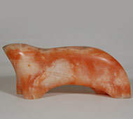 This very stylized sculpture of a bear was carved from Popsicle Alabaster that has a beautiful warm coral color and a fine polish.  According to the owner, it dates to the mid-1980s.  It is signed Haozous on the lower right leg.   Bob Haozous is a Warm Springs Chiricahua Apache Indian and the son of famous sculptor Allan Houser.  Haozous has major art sculptures in two dozen cities in the United States and Europe.  He has been included in many exhibitions, numbering over two dozen.  He is recognized as a major American Indian artist of the 20th century.   Condition: original condition except there may be a small abrasion on the bear's head. Provenance: from the collection of Michael Hamilton, manager of the Case Trading Post, Wheelwright Museum in Santa Fe from 1978 to 1998.