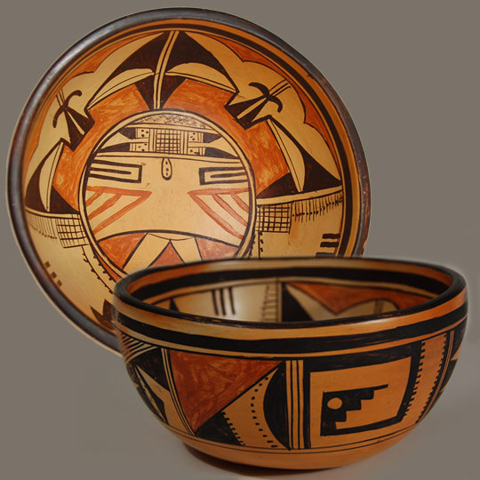 It is most unusual to see a bowl by Paqua Naha with a Palhikmana Katsina face as decoration. I don't recall ever seeing one before. Paqua Naha was the original Frog Woman (1890-1955) and the mother of Joy Navasie, the second Frog Woman (1919-2012). This bowl is decorated inside and out. The exterior is a variety of geometric designs, including rain and clouds. The interior shows the face of the Palhikmana Katsina on the bottom of the bowl and the tableta around the wall of the bowl above her face and her dress around the wall below her face.   Condition: structurally in excellent condition, with some minor abrasion to the exterior design. Provenance:  from the collection of an Oregon client Recommended Reading:  Hopi-Tewa Pottery: 500 Artist Biographies [1st ED/1st Print:] by Gregory and Angie Schaaf