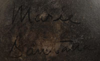This plate is signed Marie & Santana, the earlier signature, indicating that it was made from mid-1940s to mid-1950s, which would place it in the 60+ years of age.  