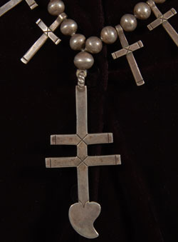 The heart at the bottom of the double bar cross is referred to as the "heart of the dragonfly."