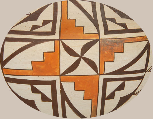There is a Mary Histia jar documented in Dillingham that features the same stepped elements as shown in orange in this jar.  In the Dillingham illustration, the four stepped elements are centered with a flower and in this jar they are centered with a propeller-like element.  
