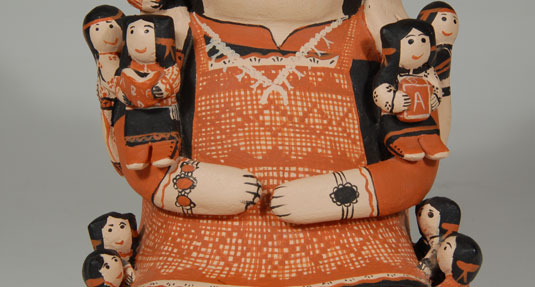 Close-up view of female storyteller and children