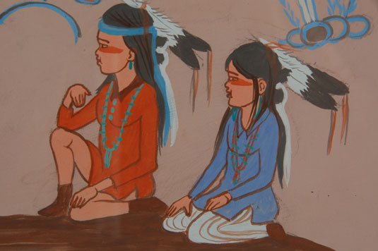 In this painting of an elder Diné, with young children gathered by him, we are reminded that there was a time when stories about great deeds of the past were verbally relayed to the younger generation. 