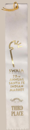 From our Item #C3645A - a Third Place award at the 1999 Santa Fe Indian Market that year.  Wanda has received awards since 1975 and every year from 1987 to 1998 and constantly since then.