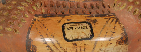 The typical paper label seen on many items from Keams Trading Post is on the wall of this jar.  It states From The Hopi Villages.  Very faint on the paper tag is the price 35ȼ.