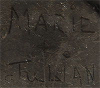 Maria had a very distinctive signature when writing her and Julian’s names and it varied little, if at all, during her long career.  This jar does not bear the handwriting of Maria.  It does not mean that Maria did not make the jar and that Julian did not paint the design, it only means that another member of the family may have signed the jar with their names because perhaps Maria was occupied with making pottery or entertaining tourists.