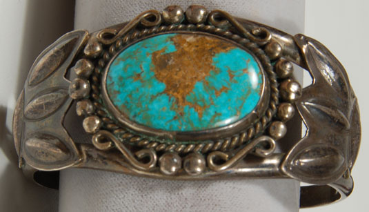 The turquoise cab has a beautiful copper matrix in the center of the stone that resembles the shape of South America. 