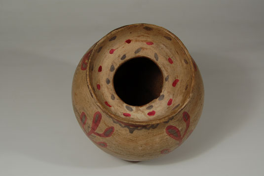 Inside the neck is a support of the type seen with jars that have lids but there are no wear patterns to indicate that this jar ever had a lid.  