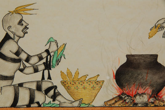 Close up view:One Koosa Clown is shucking ears of corn, a second one is putting the corn in a boiling pot and the third one is beating a drum.  