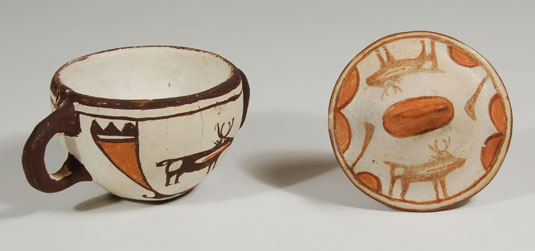 Top of Lid view - removed from sugar bowl.  The variation is color of the lid and bowl is due to firing.  It is not an indication that the bowl and lid are not original to each other.