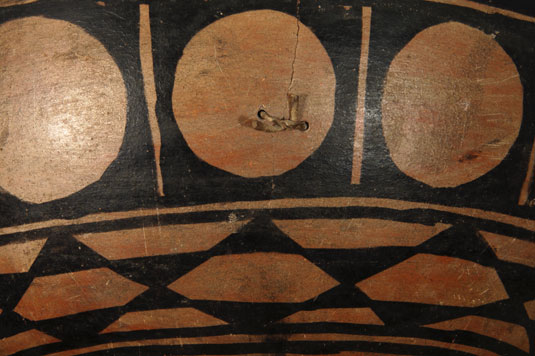 Close up view of side panel design - In traditional fashion, holes were drilled on opposite sides of the crack and then rawhide was used to reinforce the vessel wall at the crack.