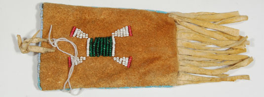 There is a beaded design on front and back and a row of beads around the edge.  