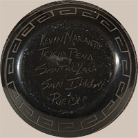This jar is signed Kevin Naranjo / Tricia Pena / Santa Clara / San Ildefonso Pueblo on the base.