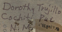 Signature of Dorothy Loretto Trujillo (1932 - 1999).  This nine-piece nacimiento has accession numbers on the figurines that begins with 85-, usually an indication of the year of acquisition by a museum.  