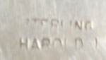   It is stamped STERLING and HAROLD * where * is an unidentified first name letter.  So, we cannot identify the exact artist – but can say it’s from the HAROLD family of jewelers.