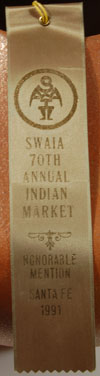 RIBBON - .  The jar was awarded an Honorable Mention at the Santa Fe Indian Market in 1991.