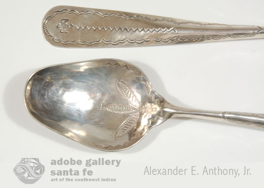 In this pair of silver salad service fork and spoon, the thunderbirds, following the Fred Harvey logo, are stamped on the handles as well as in the bowls of each utensil.  