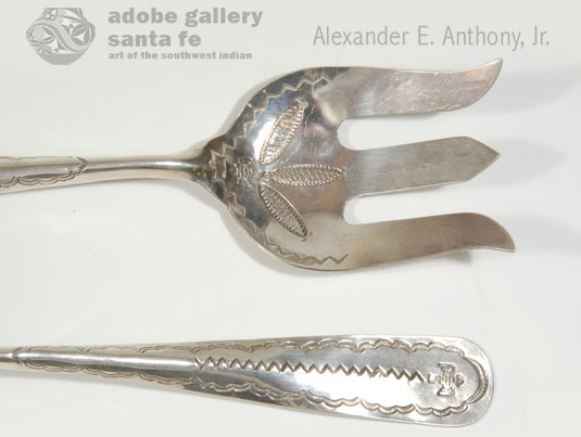 In this pair of silver salad service fork and spoon, the thunderbirds, following the Fred Harvey logo, are stamped on the handles as well as in the bowls of each utensil.  