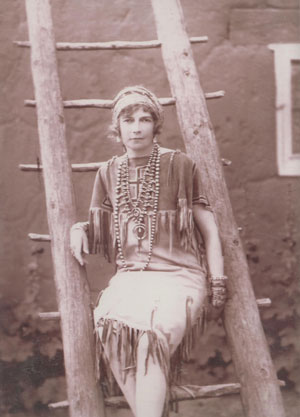 The original owner of this amazingly beautiful Navajo-made squash blossom necklace, Mona Morse Walker, formerly of New York, came to New Mexico in 1916 with her husband, who had just been selected by Calvin Coolidge to be on the Pueblo Lands Board.  The two men had been college classmates. For the next two years, when they made several trips, she purchased many items of Native jewelry, as evidenced by the attached photograph.