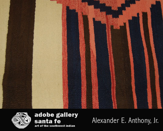 Close up view of this textile - notice the red, indigo and alternating brown and white stripes.