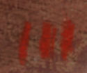 The artist’s signature—three red vertical lines—is at the bottom right corner.  