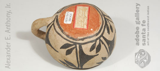 There is a paper label on the underside that states “Drinking Cup Cochiti” executed in beautiful cursive script.